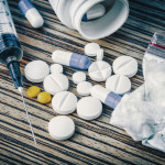 syringe and pills