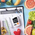 blood sugar log and sugar monitor and fruits and vegetables