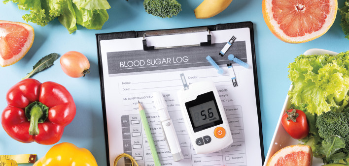 blood sugar log and sugar monitor and fruits and vegetables