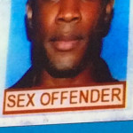 HIV advocate Robert Suttle displays his driver’s license during an AIDS conference presentation