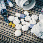 syringe and pills