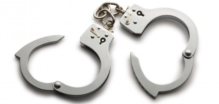 a pair of unlocked hand cuffs