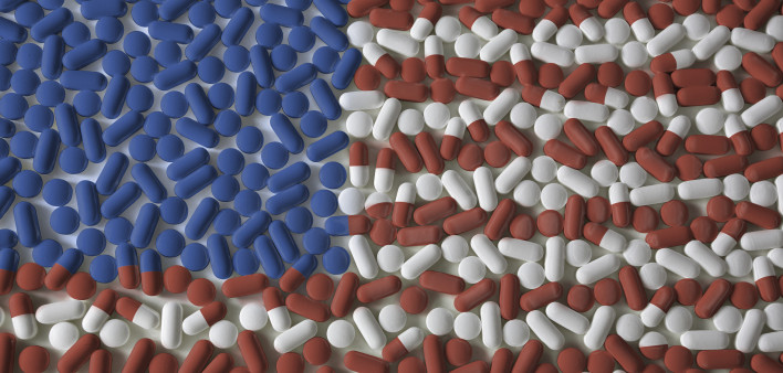 Medicated United States. An American flag made from red, white, and blue pills. US Healthcare reform background concept.