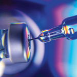 needle going into vial vaccine