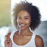 Woman holding toothbrush