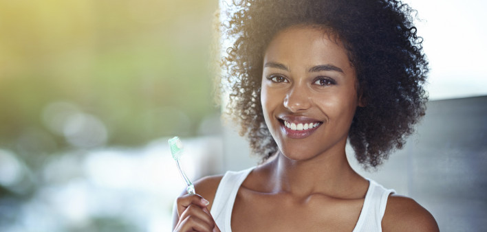 Woman holding toothbrush