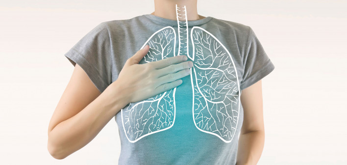 woman holding chest diagram of lungs