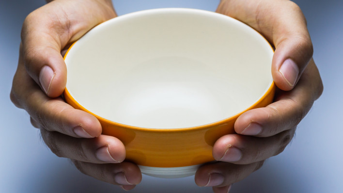 hands holding empty bowl