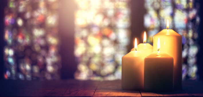 light candles against stained glass windows