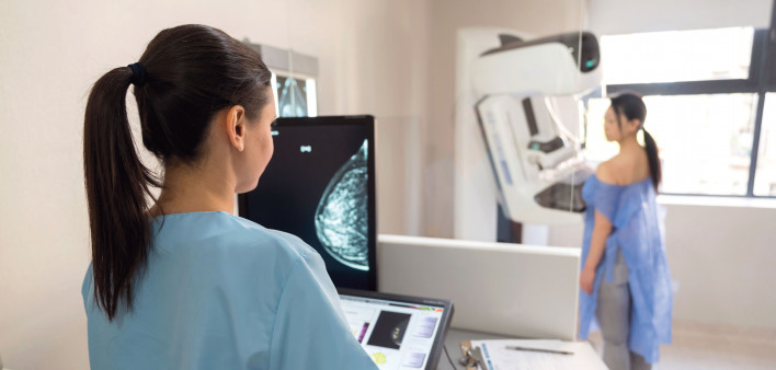 mammogram tech and patient