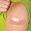 arm with band aid after vaccine