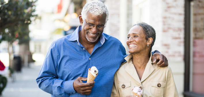 A senior african american couple enjoy an evening on the town with ice cream