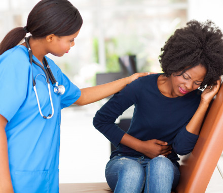 woman girl stomach cramps with nurse