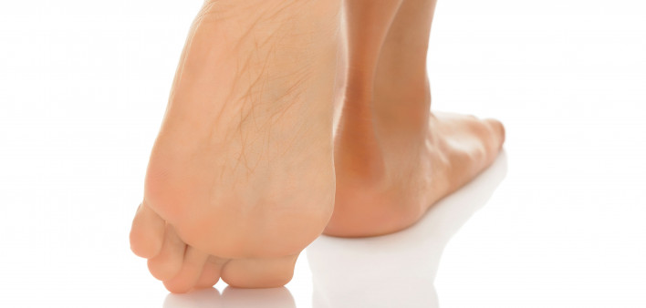woman's bare legs and feet