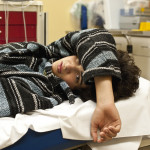 Teenager in a hospital emergency room looking at the camera, could be for overdose, alcohol, depression, accident or any other medical condition