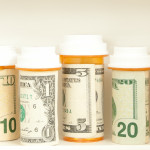 pill bottles with money as labels cost of healthcare