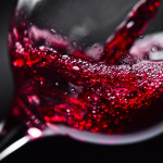 red wine pouring into glass