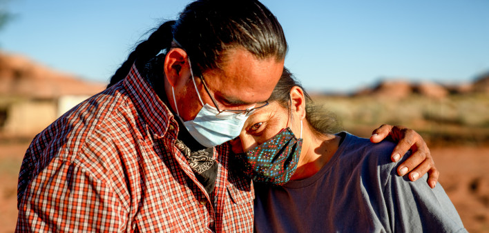 A Navajo husband and wife encourage one another because of the Coronavirus curfew by the Tribal Council in Arizona