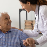 doctor happy conversation smilng with male patient