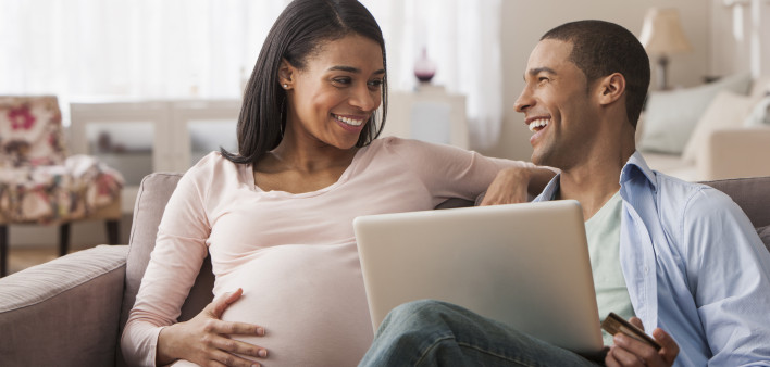 pregant woman smilng couple
