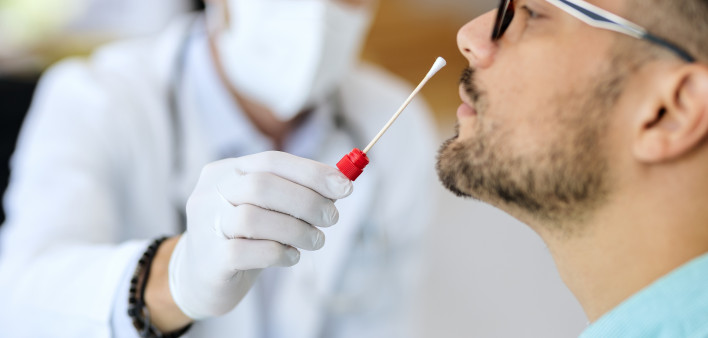 Close-up of young man getting PCR test at doctor's office during coronavirus epidemic. (56 kB)