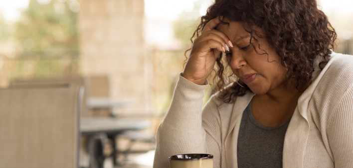 African American middle age woman looking sad.