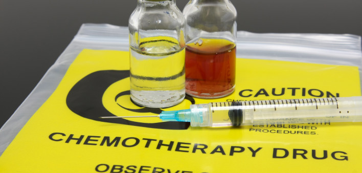 A syringe and two vials of chemotherapy drugs