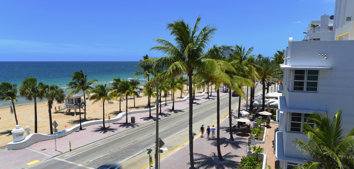 Sunrise Beach in Ft.Lauderdale with palm trees and beach entry feature.
