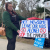 Vaccine protester Jessica Holloway of Lake County urges California lawmakers and Gov. Gavin Newsom to reject vaccine mandates at a rally in front of the state Capitol in early January.