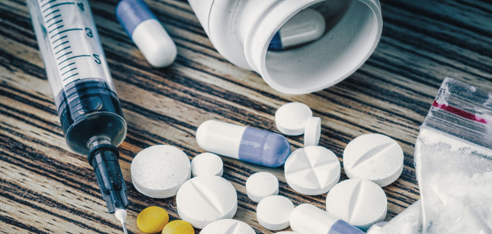 syringe and pills