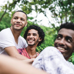 Gay friends having a good time at public park