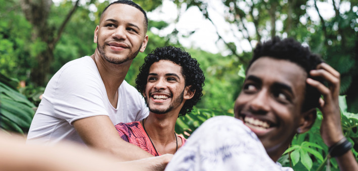 Gay friends having a good time at public park