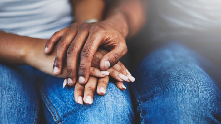african american couple holding hands