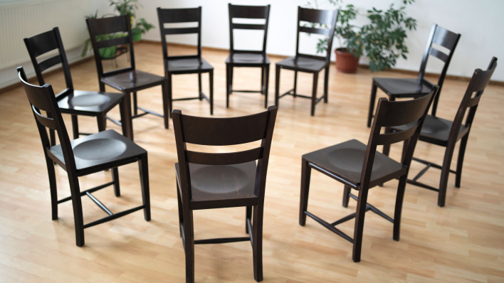 chairs arranged in a circle support group aa meeting