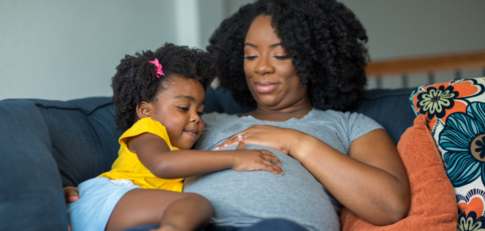 pregnant mother and young girl