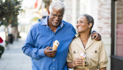 A senior african american couple enjoy an evening on the town with ice cream