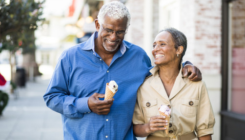 A senior african american couple enjoy an evening on the town with ice cream