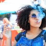 African American woman smoking in cafeteria