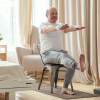 man exercising sitting in a chair