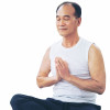 asian man practicing meditation