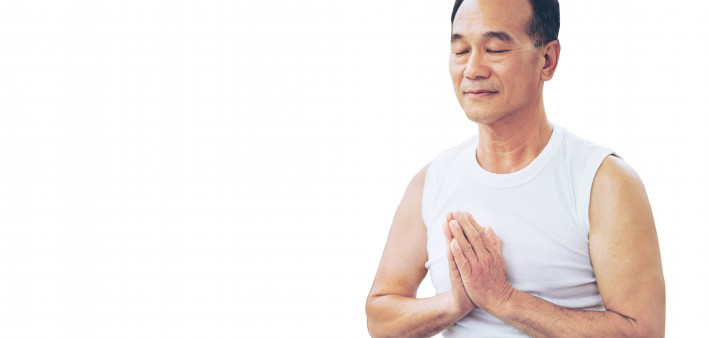 asian man practicing meditation