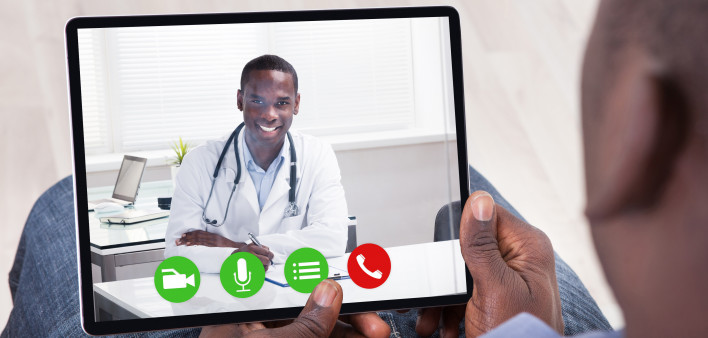 Close-up Of African Person Holding Blank Digital Tablet