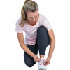 woman jogger tying shoe laces