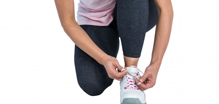 woman jogger tying shoe laces