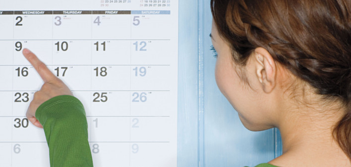 Girl pointing at calendar