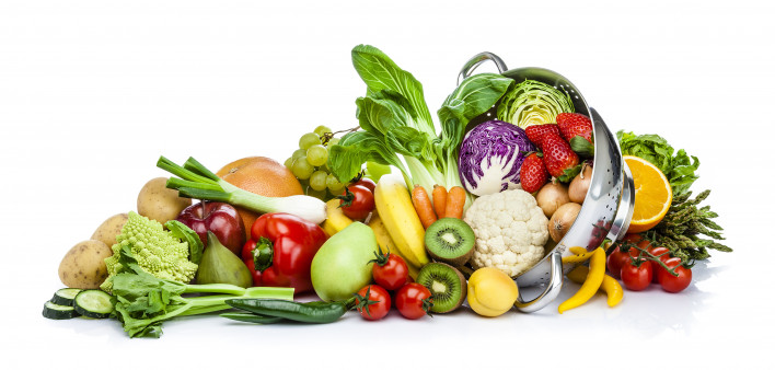 Healthy fresh fruits and vegetables in a colander