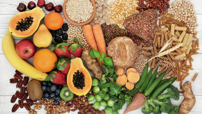 food with high fiber content for a healthy diet with fruit, vegetables, whole wheat bread, pasta, nuts, legumes, grains and cereals