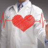 doctor in white coat drawing a red heart on glass