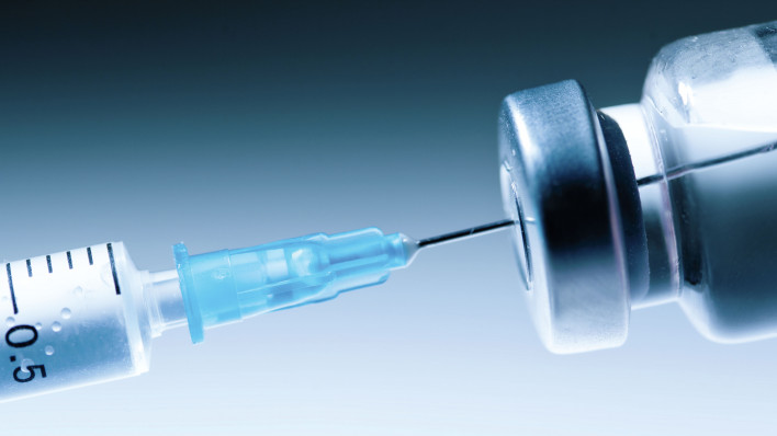 Medical syringe with a needle and a bollte with vaccine
