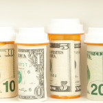 pill bottles with money as labels cost of healthcare